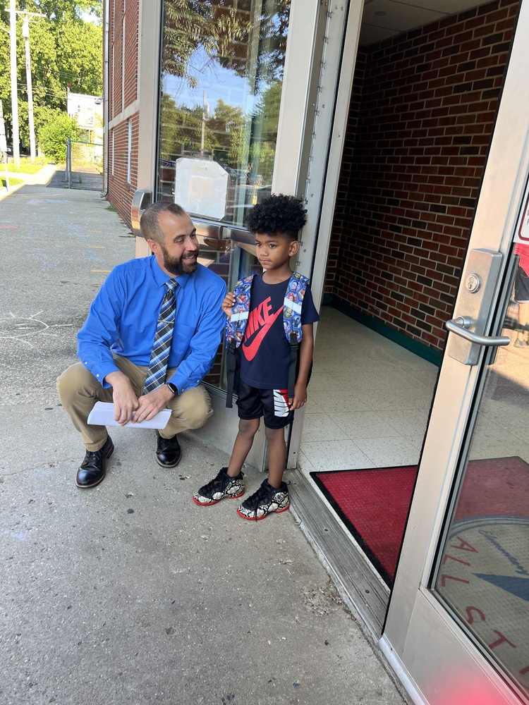 Principal with young student at Graham elementary 