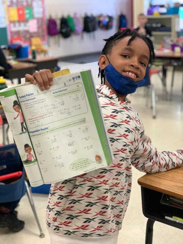 student happy to have completed his math