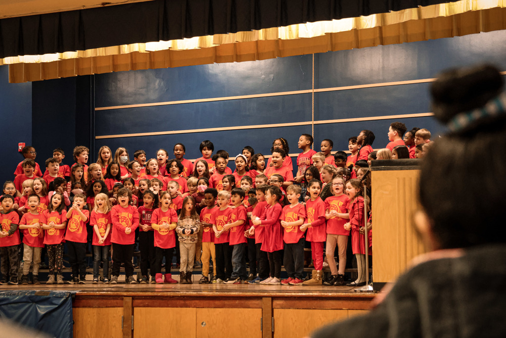 1st graders singing a song on the stage