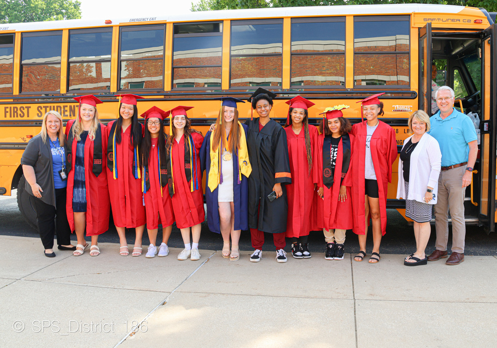 Graduates pose with Superintendent Gill