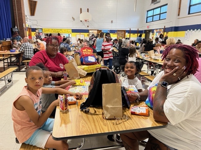 students and families playing games 