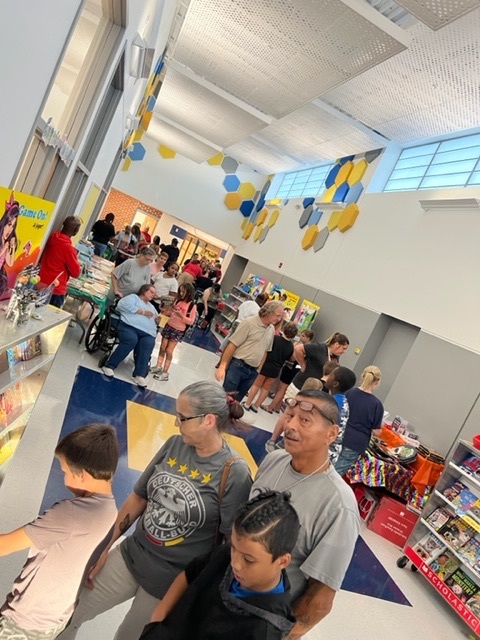 families looking at books at the book fair