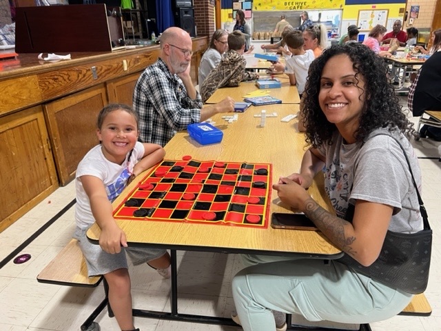 students and families playing games 