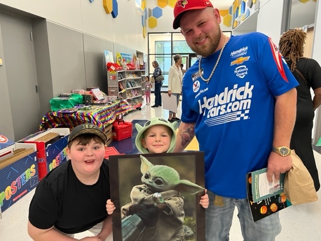 student and family at the book fair