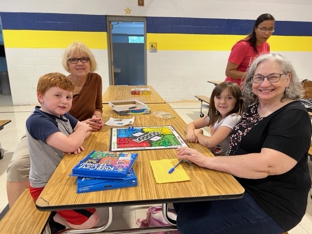 students and families playing games 