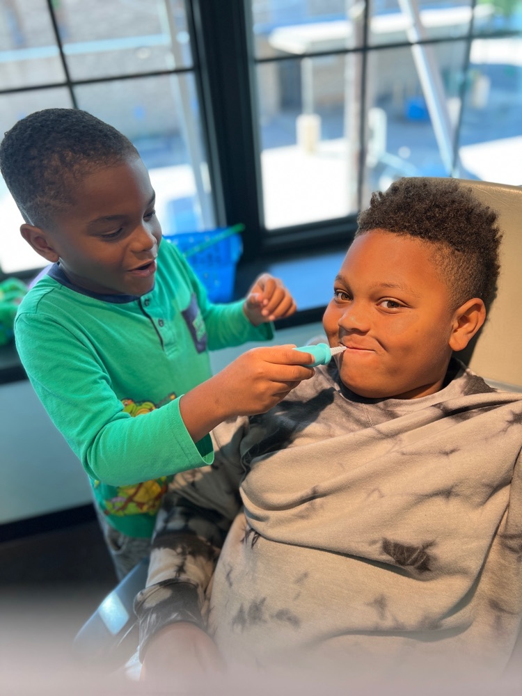 students playing dentist 