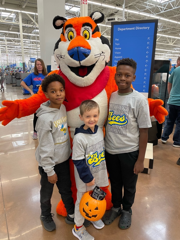 3 students with Tony the Tiger 