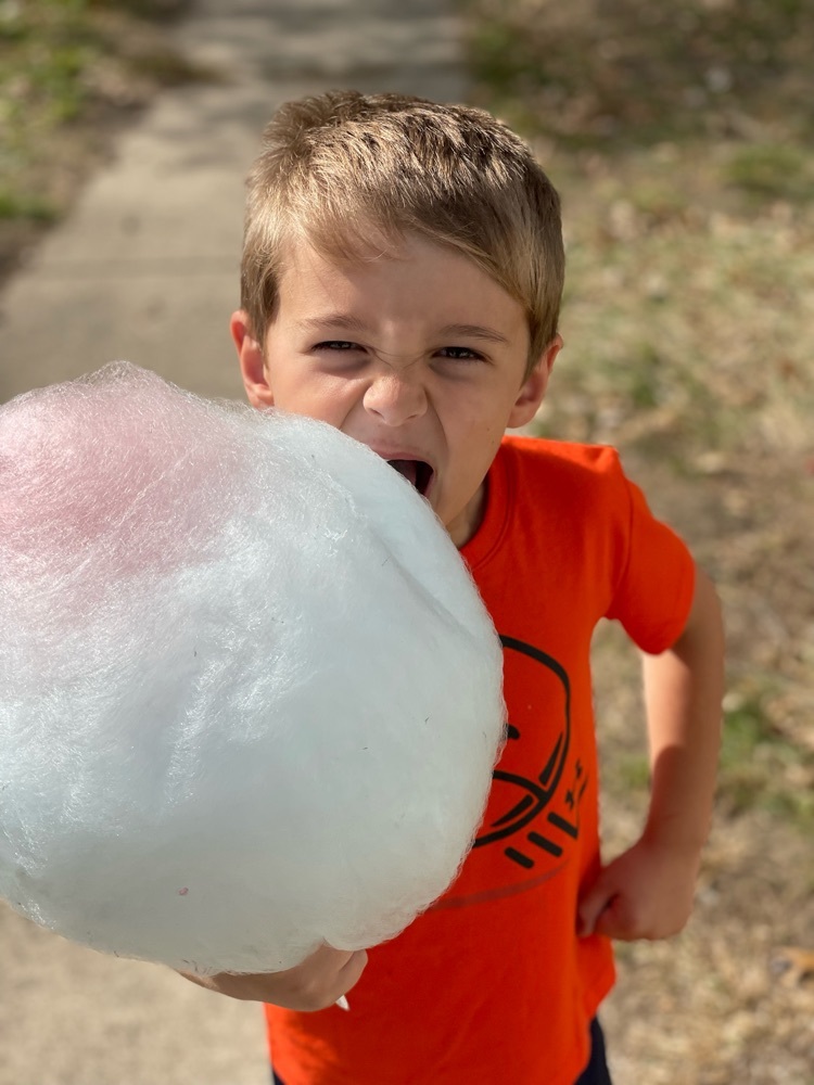 student eating fitting candy