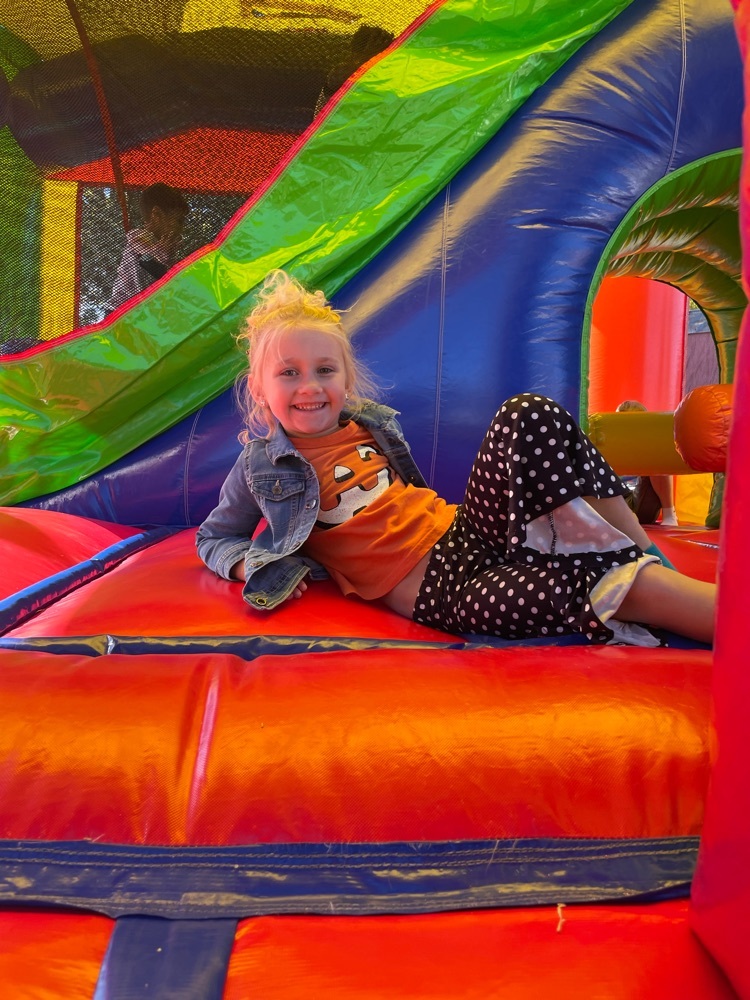 student in bounce house 