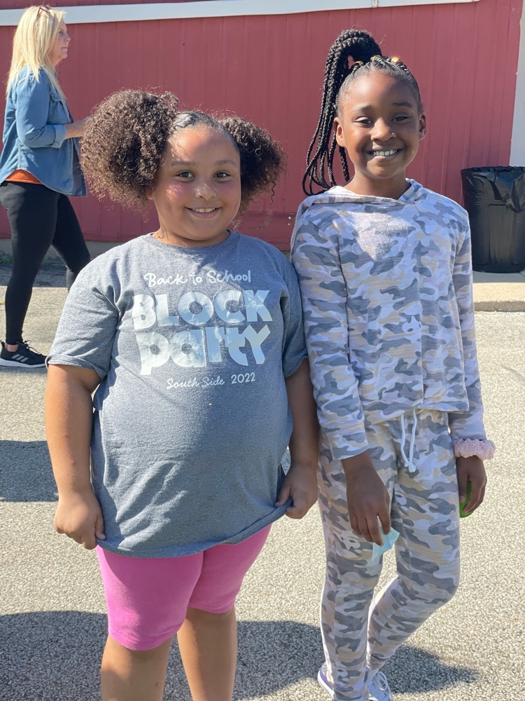 two students smiling 