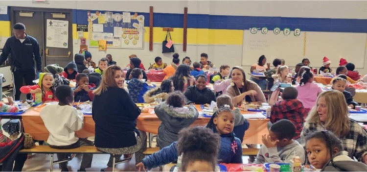 students and staff eating lunch together 