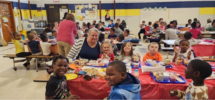 students and staff eating lunch together 