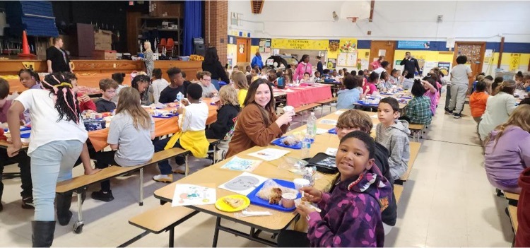 students and staff eating lunch together 