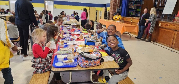 students and staff eating lunch together 