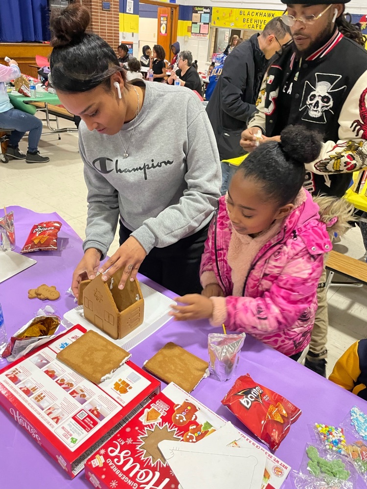 family making a gingerbread house 