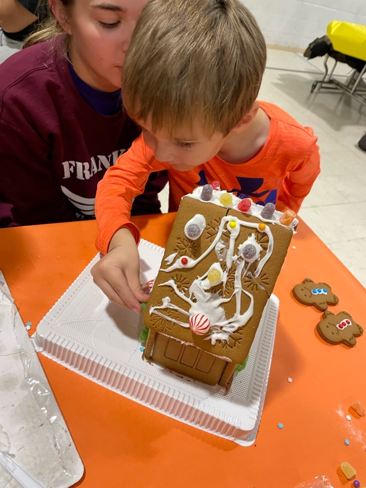 family making a gingerbread house 