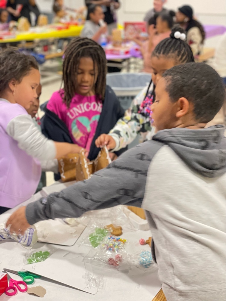 students making a gingerbread house 