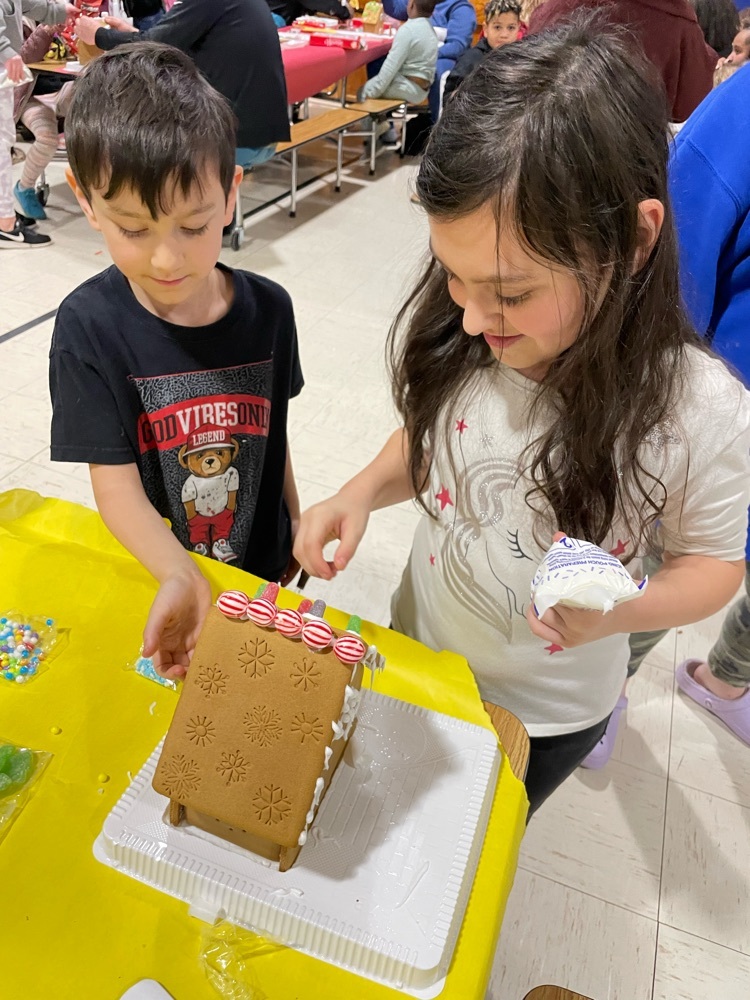 students making a gingerbread house 