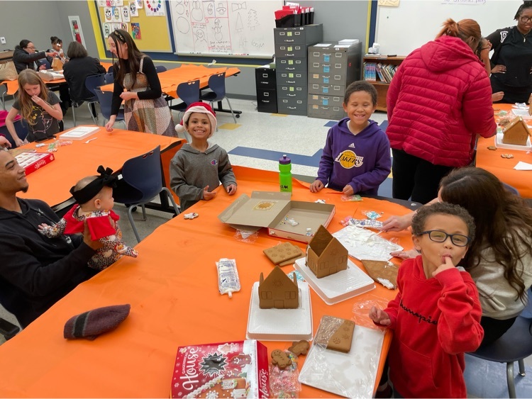 family making a gingerbread house 