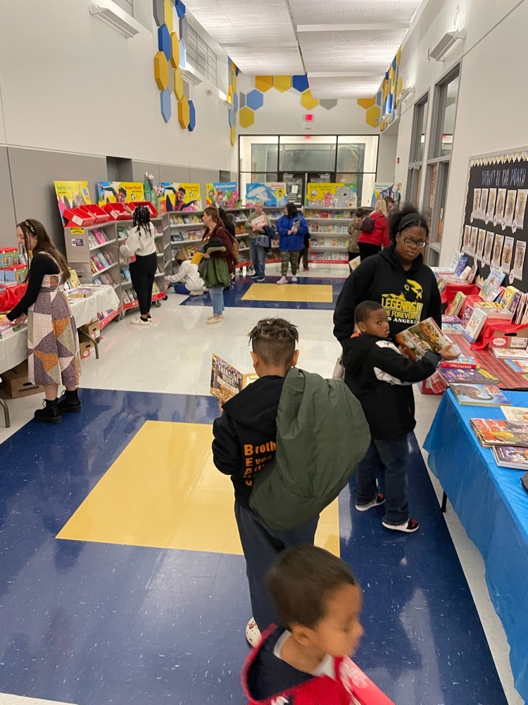 students looking at books at the book fair 